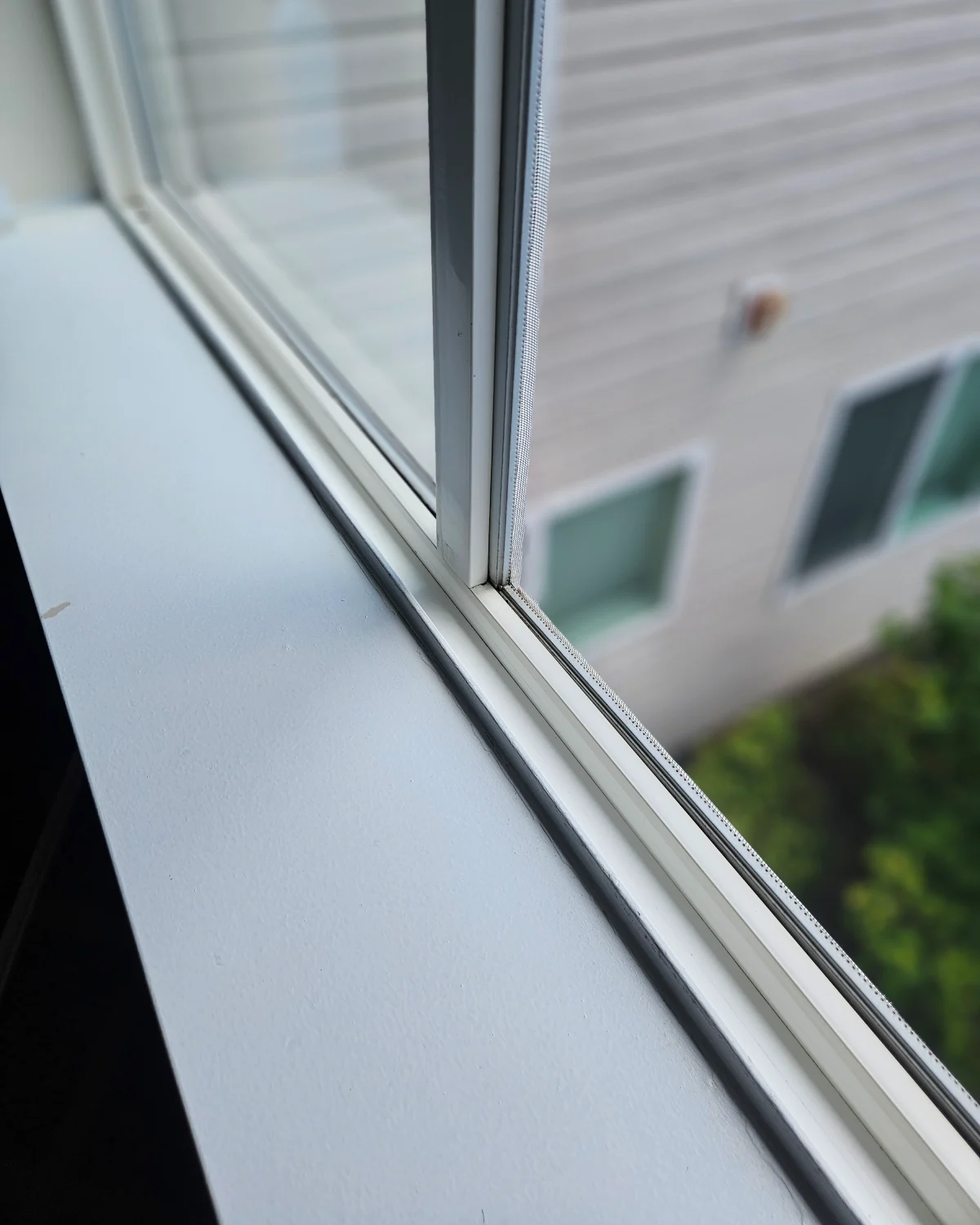 After photo of an apartment bedroom window track cleaned by Clary Clean and restored to a like-new appearance