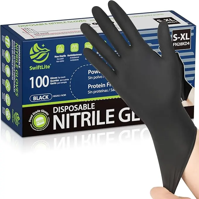 Black nitrile gloves being used while washing a dish at a sink